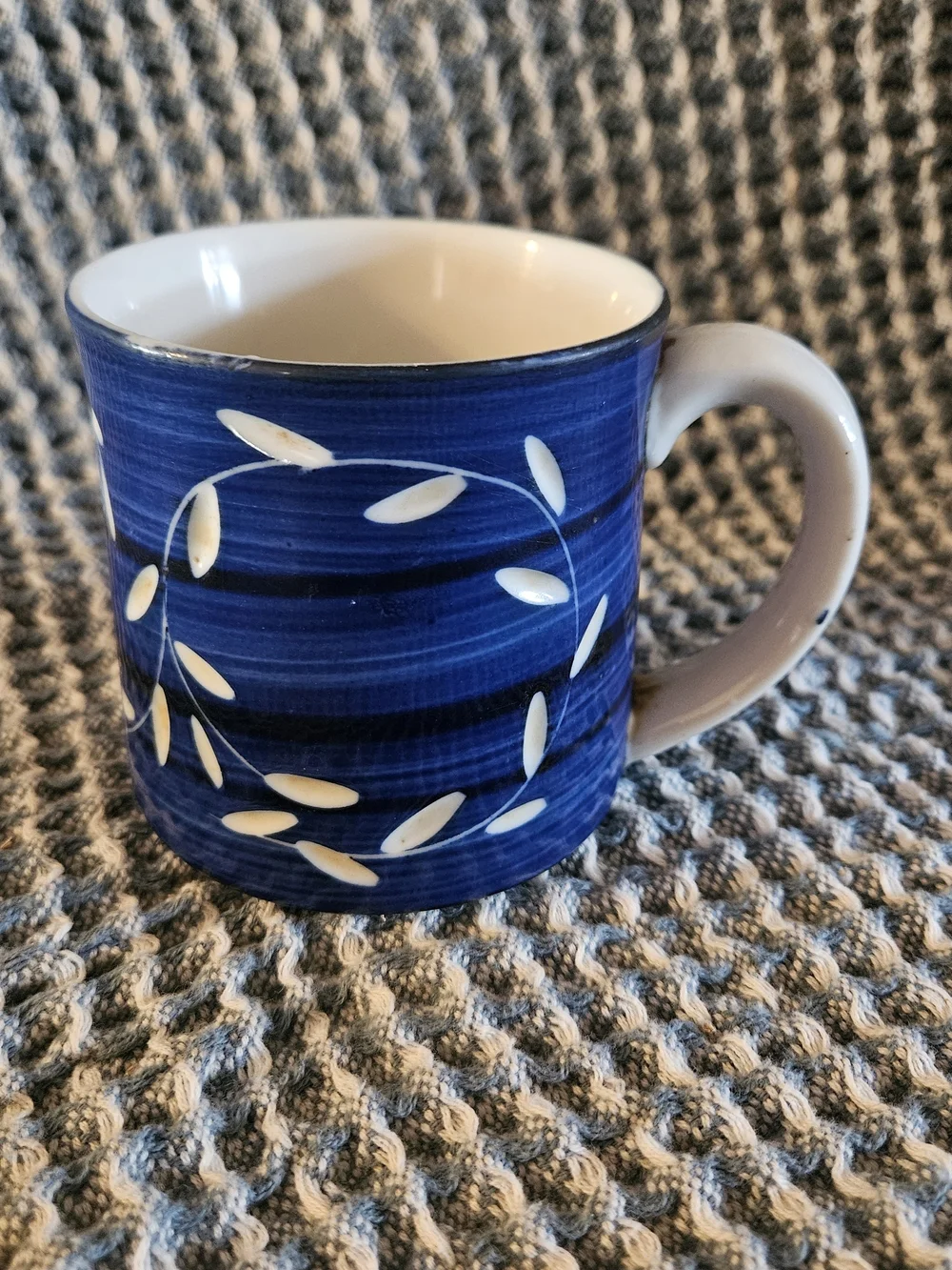 Blue Ceramic Coffee Mug with White Leaf Accent